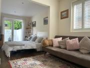 Sanctuary by the Sea with large room incl lounge area, bathroom, direct garden access & free parking
