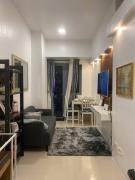 1BR CONDO Fame Residences Mandaluyong- Be My Guest Staycation- Near SM Megamall, Greenfield District, & Ortigas