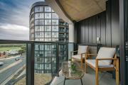 Elegant 2BR Stay with Gym, Cinema & Pool in ACT