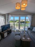 STYLISH HOLIDAY HOME WITH UNINTERRUPTED VIEWS OF THE FLEET LAGOON ON Haven LITTLESEA HOLIDAY PARK