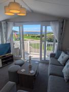 STYLISH HOLIDAY HOME WITH UNINTERRUPTED VIEWS OF THE FLEET LAGOON ON Haven LITTLESEA HOLIDAY PARK