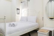 White and Nice 1BR at Bassura City Apartment By Travelio