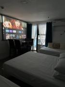 Studio w projector Wifi Netflix and pool access in ADB Tower Ortigas CBD