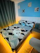 Beach Vibe Condo with PS4, Mini Karaoke, Board Games in Azure North San Fernando Pampanga