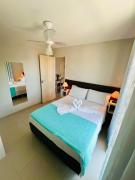 Praticidade e Aconchego: Apto. a 7min da Praia