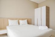 Minimalist and Comfort Living 1BR at Ciputra International Apartment By Travelio