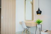 Comfy and Minimalist Studio at Embarcadero Bintaro Apartment By Travelio