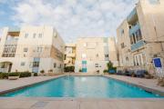 Dolmen Court Qawra fl13 w shared pool! by Homely