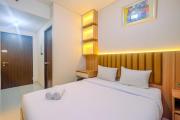 Homey and Stylish Studio Room at Transpark Cibubur Apartment By Travelio
