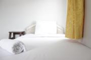 Spacious 2BR Apartment at Pinewood near JATOS By Travelio