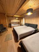 კოტეჯი ბახმაროში WoodenHouse Sunrise