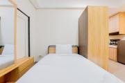 Homey and Modern Studio Apartment B Residence By Travelio