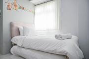 Nice and Cozy Living 2BR at Green Pramuka City Apartment By Travelio