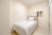 1BR with Direct Access to Pool at Parahyangan Residence Apartment By Travelio