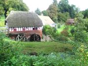 Old watermill by beautiful lake