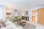 Stylish new home with parking - king beds garden