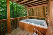 Pet friendly, hot tub, cozy log cabin sleeps 7, located between Gatlinburg and Pigeon Forge!