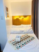 2 Bedroom and Bathroom Staycation Condo in Mandaluyong City near BONI MRT with WIFI and KARAOKE and POOL