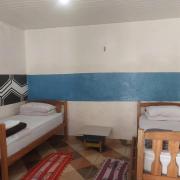 Quarto compartilhado com ar condicionado banheiro externo compartilhado