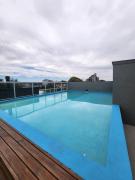 Depto céntrico en Pinamar con parrilla y piscina en la terraza