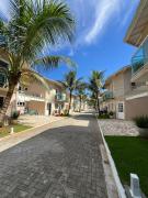 Triplex em Condomínio 20 metros da praia com AC