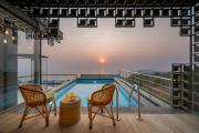 SaffronStays Nautica - 5BR hilltop villa with rooftop pool, sea views & modern interiors surrounded by greenery
