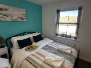 Sunny 2-Bedroom Coastal Stay with Free Parking