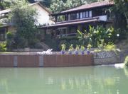 Casa de 730m2 no Exclusivo Condomínio Portogalo com Piscina Privada e Cais para iates de até 55 Pés