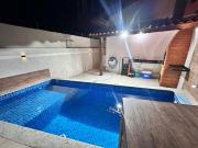 A Casa de Praia com ar, piscina aquecida e churrasqueira