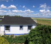 Sonniges Strandhaus mit Wasserblick am Haff mit 2 Schlafzimmern für 4 Pers