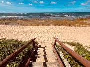 Village frente ao mar pé na areia