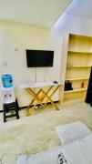 lovely fully furnished two bedroom apartment with swimming pool well equipped gym ample parking space children playing ground and a relaxing rooftop with amazing scenic views