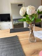 Zentrales Apartment mit Netflix, Kaffee & Parkplätzen