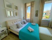 LUNA SUL PORTO Seaview Apartment - Bright and Spacious Flat in Central Nettuno, Steps from the Marina, Beaches, and Train Station