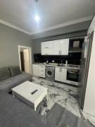 In the center, 6-7 minutes to the airport, close to the sea and coves