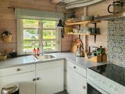 Black-Painted Log House Overlooking Vejle Fjord