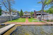 Lakefront home with kayaks fire pit hot tub and walk to restaurants and bars