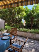 House near sea coast with green surrounding