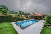 SaffronStays Silver Falls - 3BR colonial-style villa with pool, lawns, wooden bridge & monsoon waterfall views