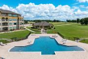 Lakefront Corsicana Condo Pool and Private Balcony!