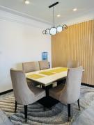 The comfort executive loft three bedroom apartment with amazing breathtaking city views , swimming pool ,gym ,private ample parking space with designated child playground area