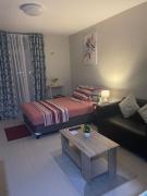 Spacious studio with balcony and guest parking