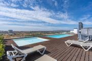 Rooftop Pools & Balcony Haven by HostWise
