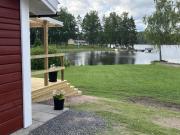 Red Cottage with Lakefront Location at Nerbjärken