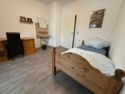 Das einfache Zimmer mit Gemeinschaftsbad