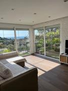 Appartement dans villa vue mer piscine partagée