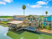 Waterfront beach house with the ultimate game room and two docks
