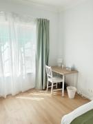 Queen room with shared bathroom