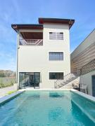 Casa Vento Verde - 5 suítes, piscina aquecida e cozinha gourmet