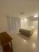 Casa com 4 suítes perto da praia